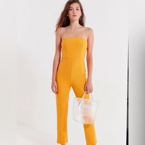 Urban Outfitters Gold Strapless Jumpsuit. Never worn. Size XS